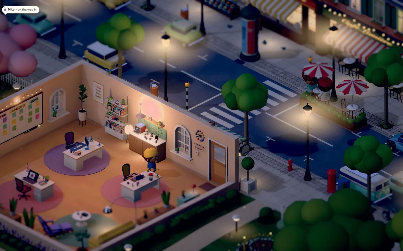 The office and the street at night, lamps and shop windows lit