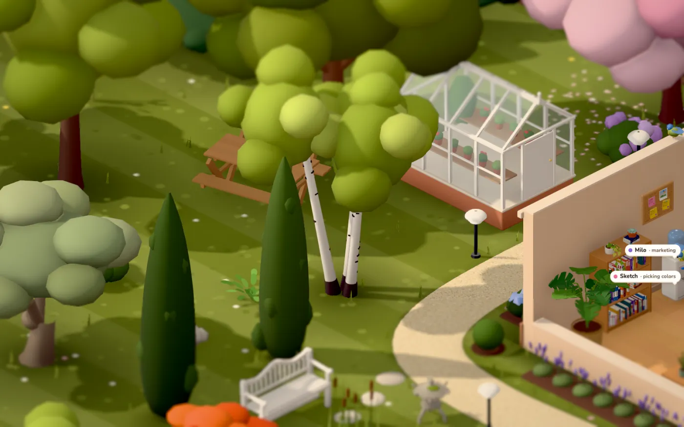 The garden behind the office with birches, a cherry tree and a glasshouse